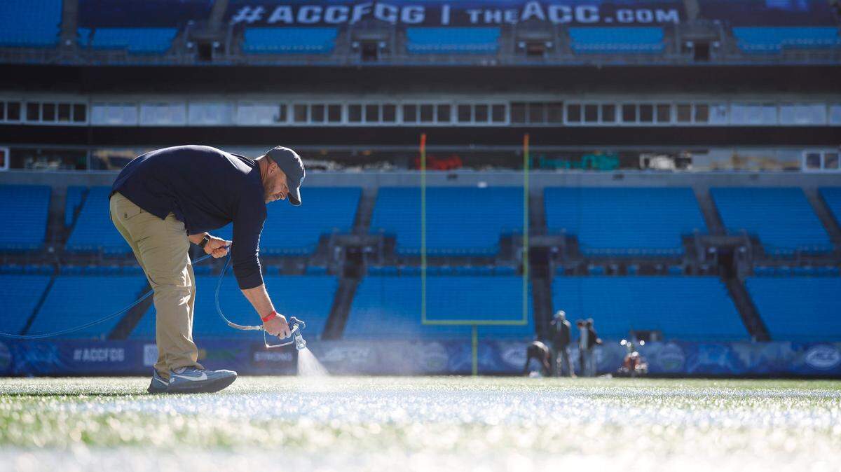 Bank of America Stadium groundskeeper curates the white lines athletes work between