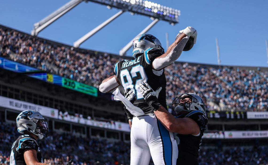 Carolina Panthers tight end Tommy Tremble celebrates a touchdown with Carolina Panthers guard Austin Corbett against the Houston Texans at the Bank of America Stadium in Charlotte, N.C., on Sunday, October 29, 2023.