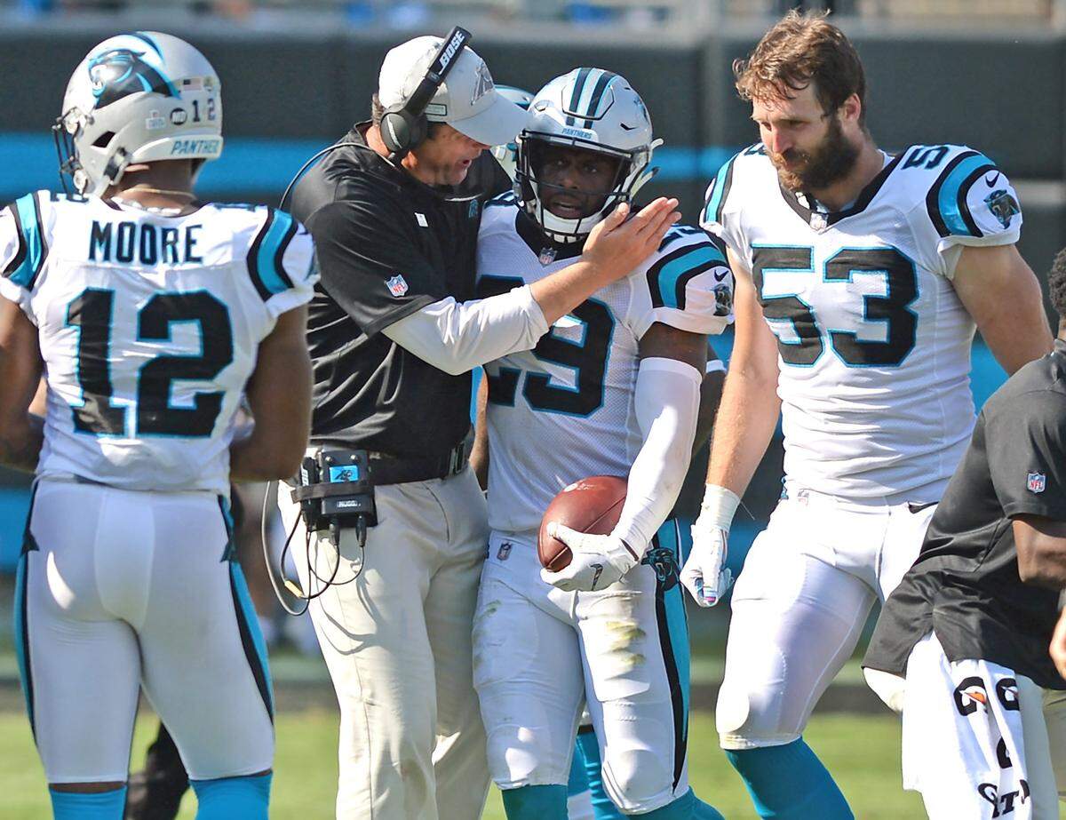 Carolina Panthers safety Mike Adams, center, had two interceptions during the team’s 33-31 win over the New York Giants Sunday, but also saw his defense allow over 400 total yards.