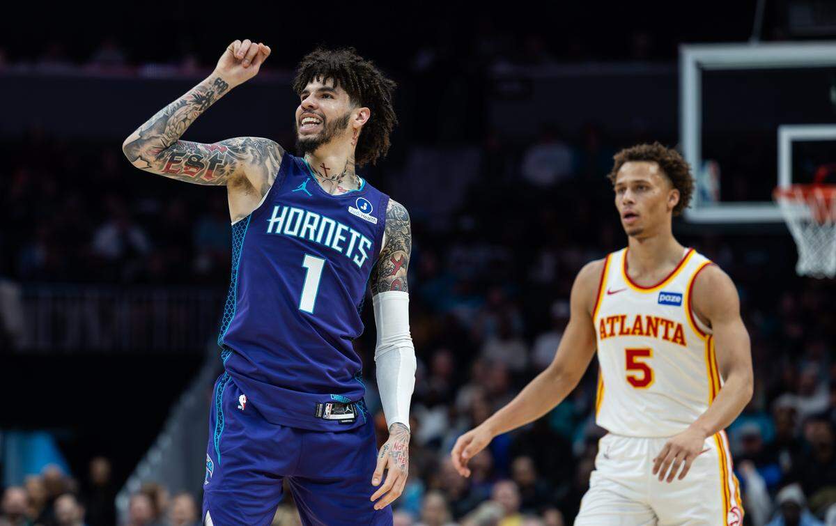 Charlotte Hornets guard LaMelo Ball smiles after making a 3-point shot at the Spectrum Center in Charlotte on Feb. 11.