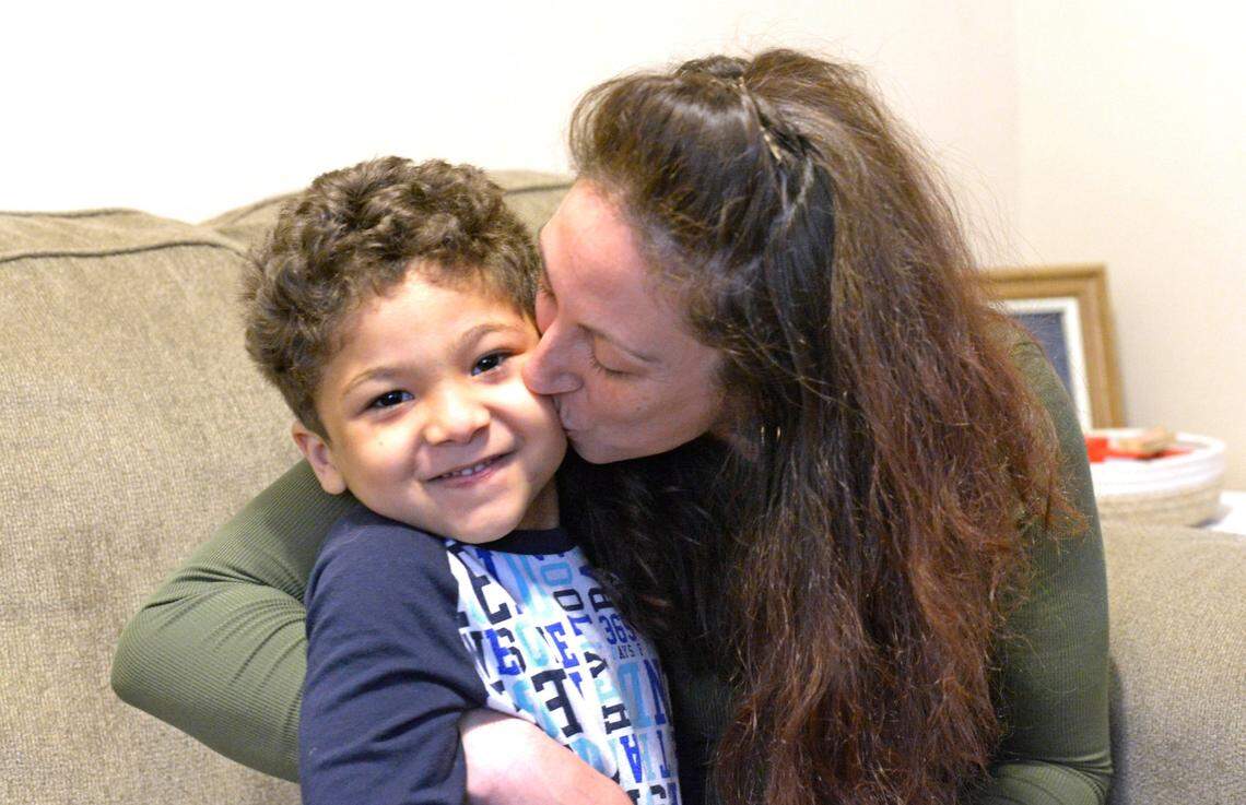 Anna Marie Fiscus, with her 5-year-old, Maurice Foster, in their Charlotte home on Wednesday March 17, 2021. In the early days of the pandemic, she lost her childcare when her son’s home daycare closed and immediately had to figure out how to work from home and juggle being a single mom during the pandemic.