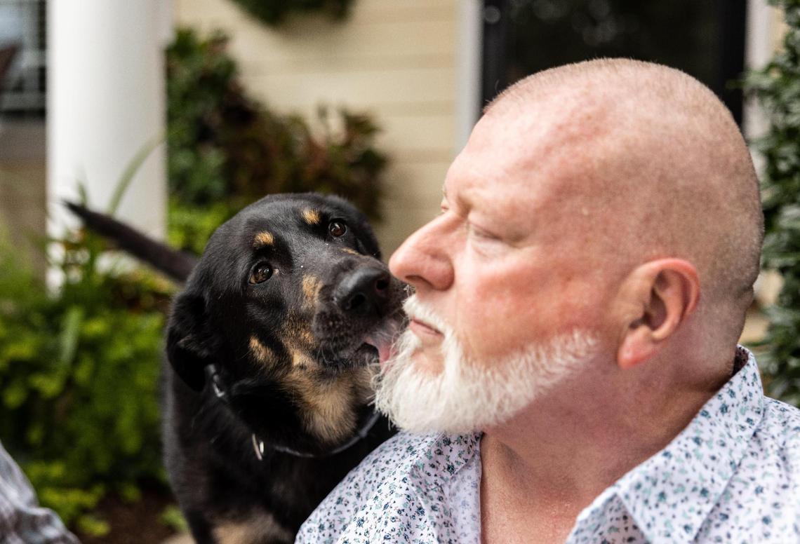 Oscar gives his new owner, Steve Nichols a kiss Friday in Indian Trail, N.C. Steve and John Winn adopted Oscar after learning about his story.