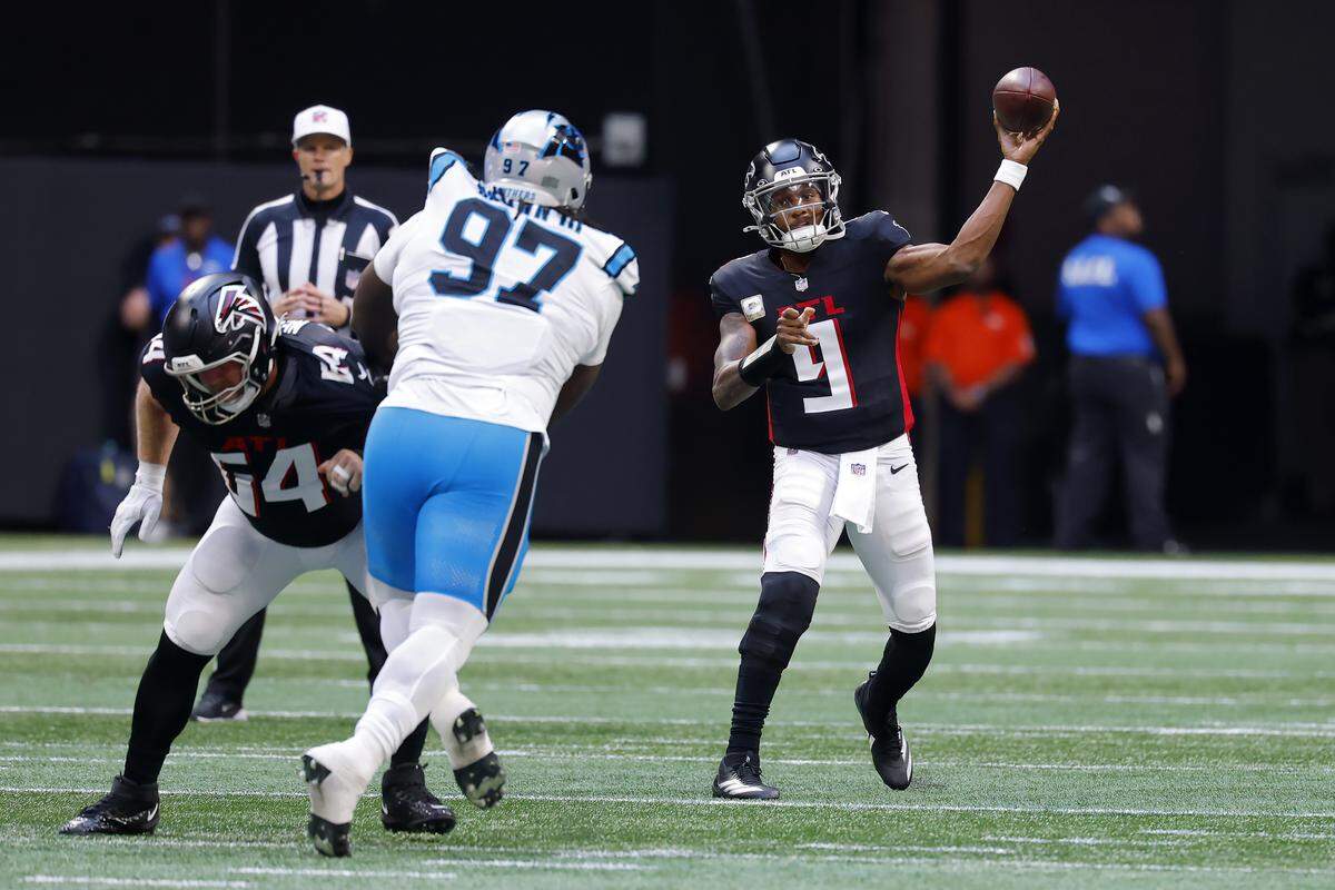 Michael Penix Jr. #9 of the Atlanta Falcons throws a pass during the second quarter against the Carolina Panthers on Sunday at Mercedes-Benz Stadium in Atlanta.
