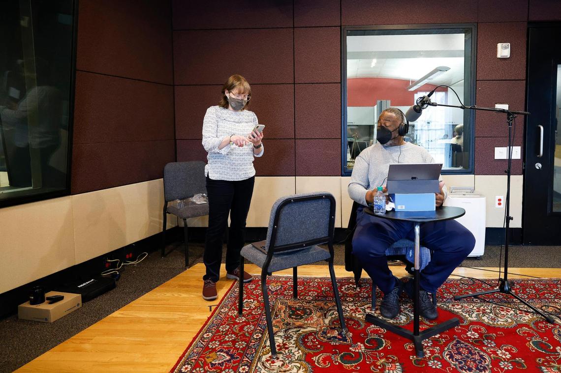 Content director and host Rachel Stewart works with bassoonist Joshua Hood as he prepares to record an interview at WDAV in Davidson.