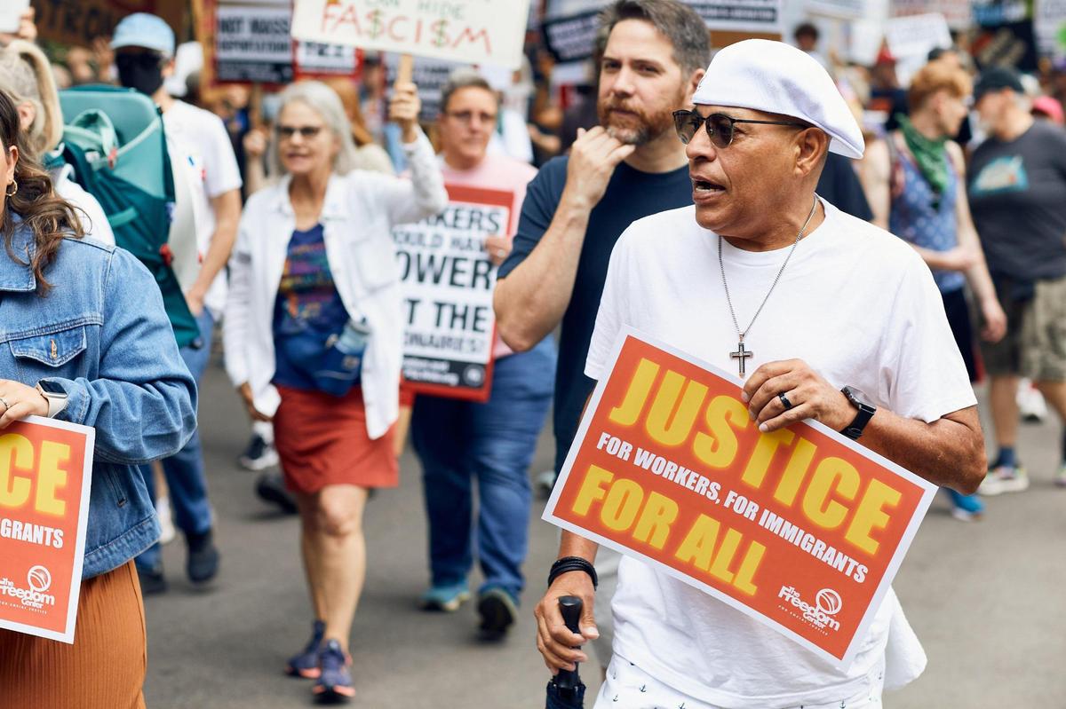 A crowd estimated at 1,500 people marched on Central Avenue for a May Day anti-Trump protest in Charlott on Saturday.