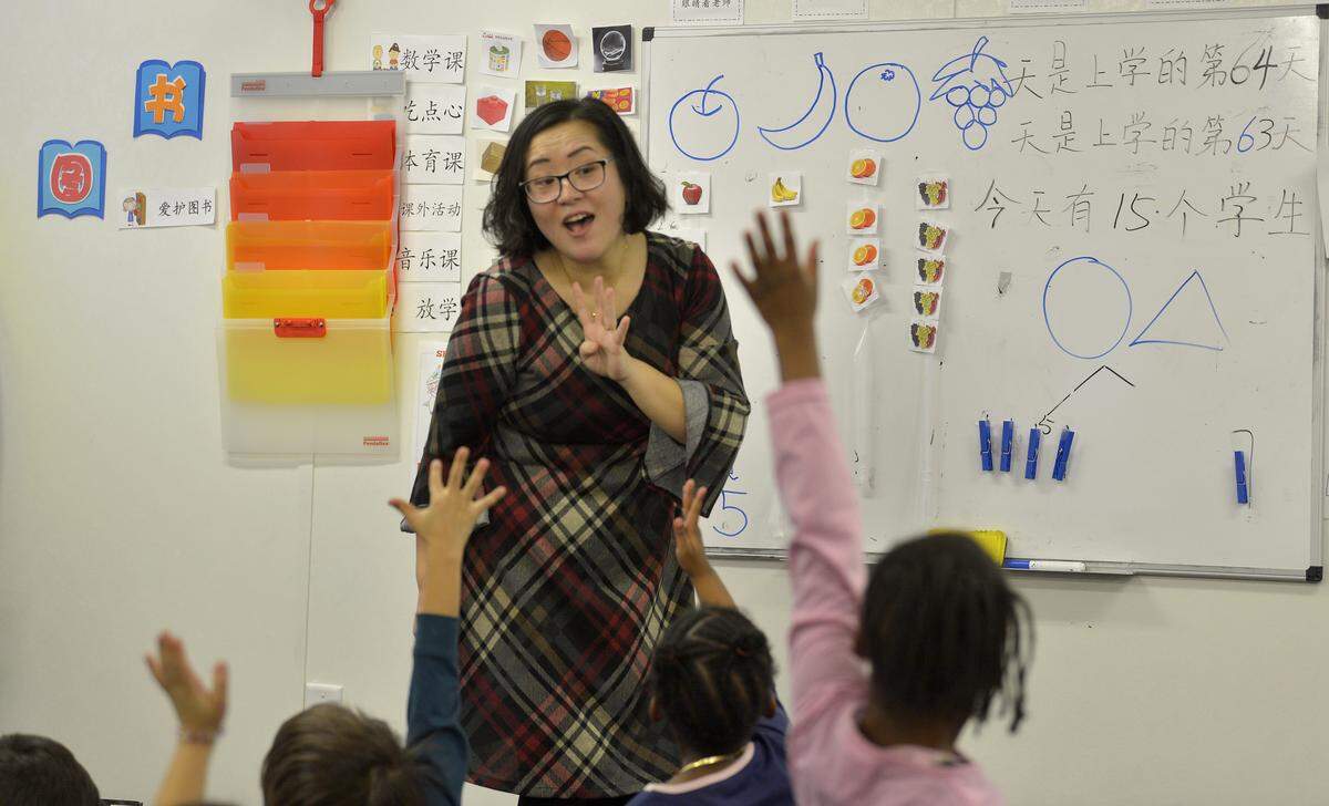 Yan Han teaches a kindergarten class at East Voyager Academy, a Chinese immersion charter school that opened with grades K-4.