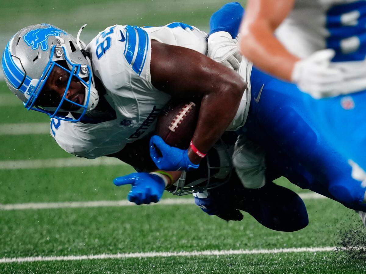 Detroit Lions tight end James Mitchell (82) is taken down, Thursday, August 8 2024, in East Rutherford.