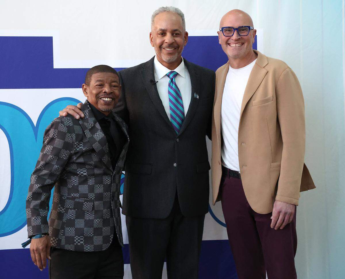 Former Charlotte Hornets Muggsy Bogues, Dell Curry and Rex Chapman pose for photographs during a reception for Dell Curry on Thursday night at Spectrum Center.