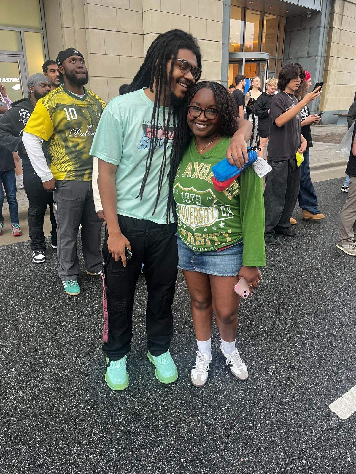 Maya Hughes and Jahkel Wilson rushed to keep up with the line to head inside to see Kendrick Lamar at Bank of America Stadium in Charlotte on Saturday, May 3, 2025. They said they were ready to have fun and are just celebrating life.