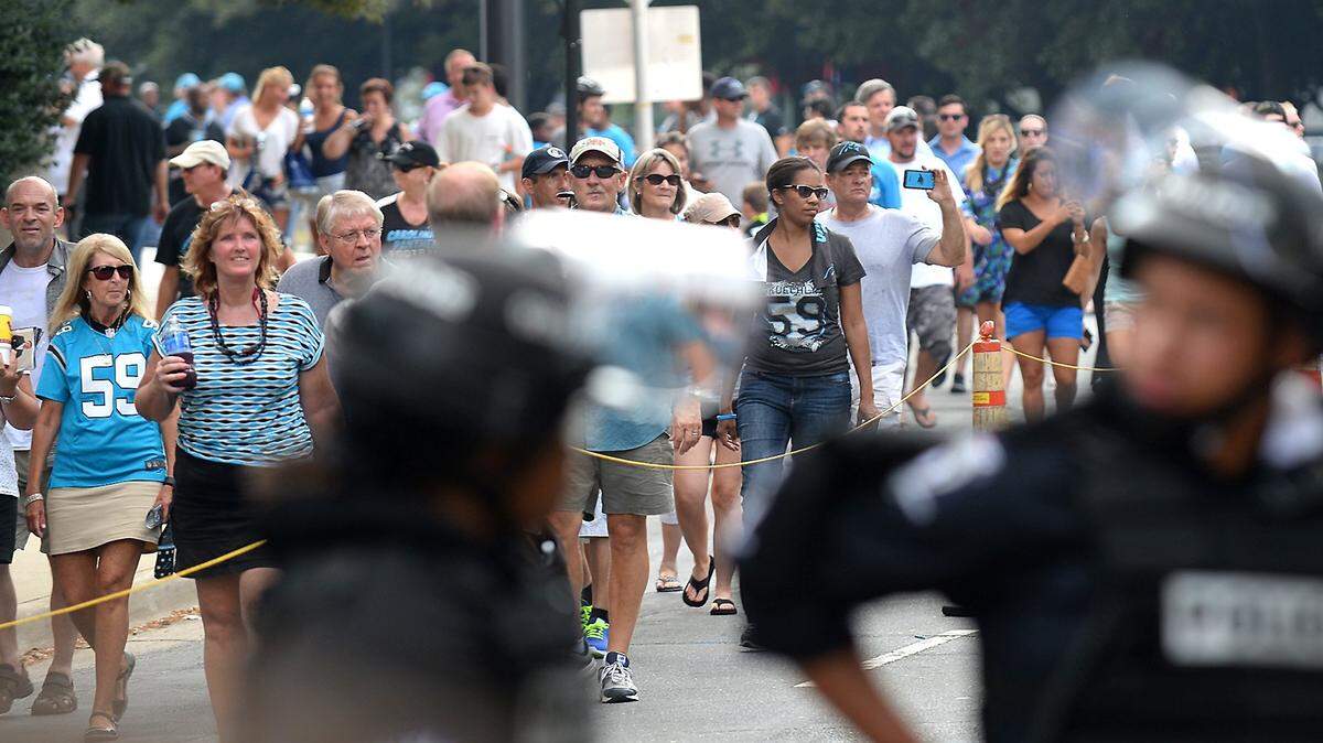 Charlotte-Mecklenburg police keep an eye on protesters as fans leave Bank of America Stadium after a Panthers game in September 2016. The local police union has raised concerns over the use of on-duty police officers over off-duty ones at stadium events.