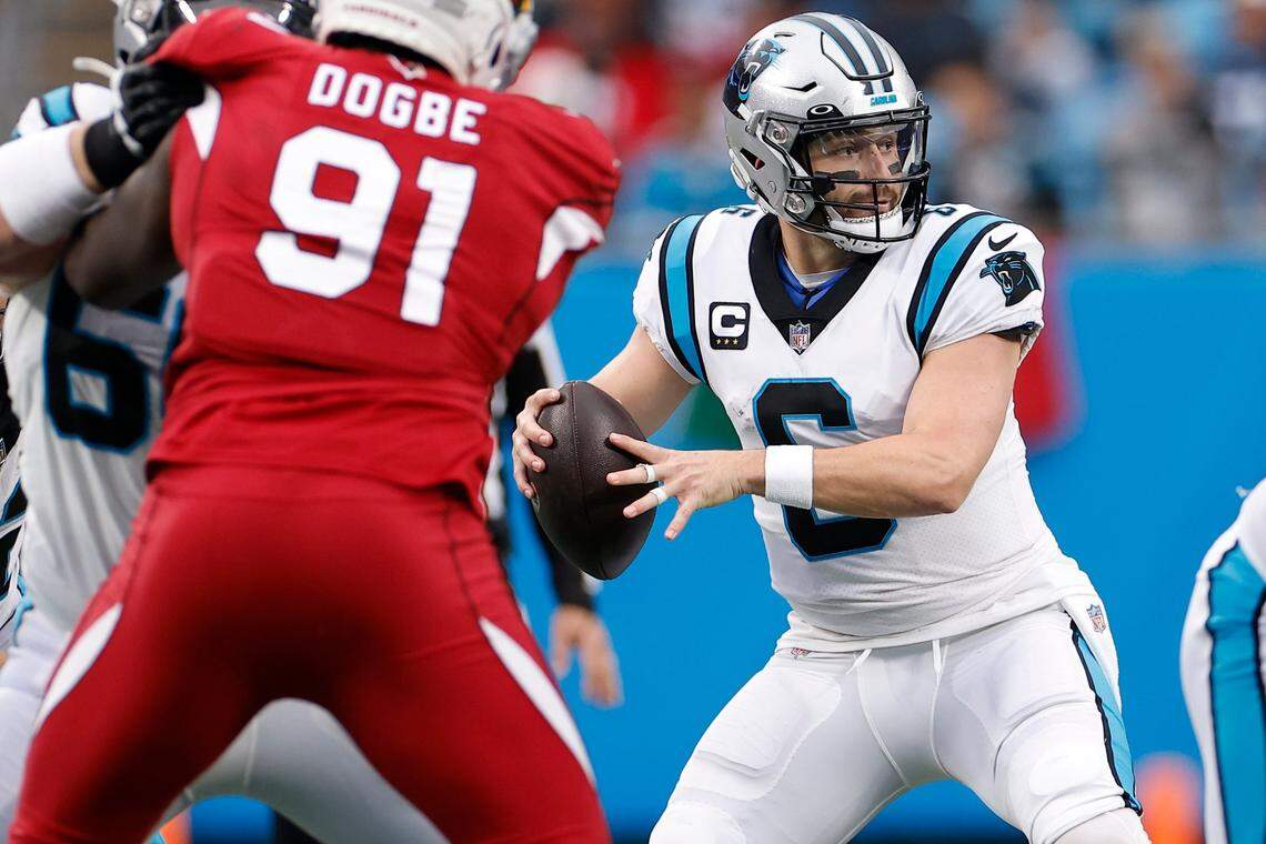 Carolina Panthers quarterback Baker Mayfield (6) passes the ball over Arizona Cardinals defense during a game at Bank of America Stadium in Charlotte, N.C., Sunday, Oct. 2, 2022.