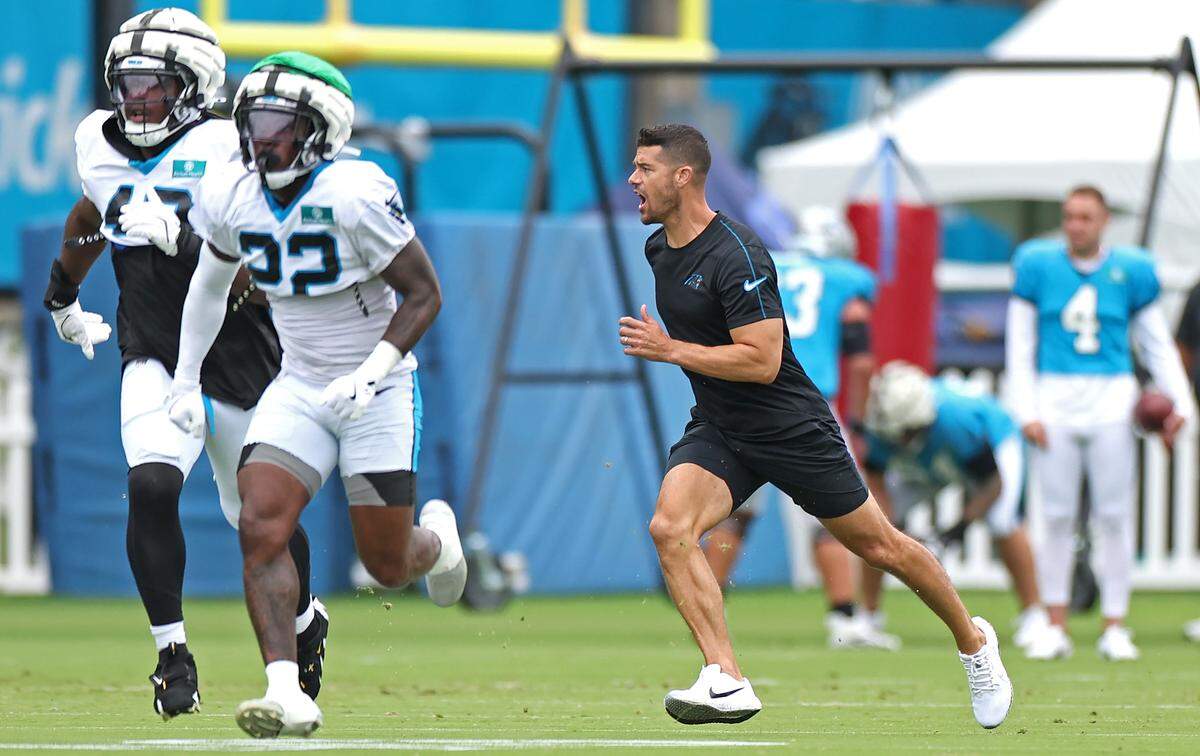 Carolina Panthers head coach Dave Canales, right, runs through special teams drills with the players during practice on Tuesday, August 6, 2024.