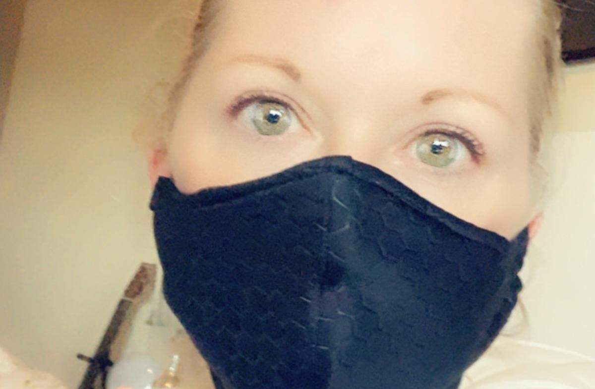 Michelle Kukral made her mask and masks for her family from a neoprene-esque fabric lined with cotton that she had left over from a dress design she recently completed.