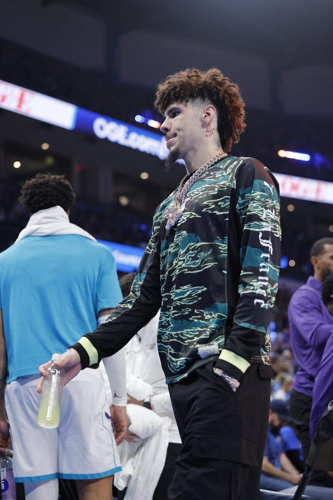Charlotte Hornets guard LaMelo Ball (1) walks to the bench during a time out against the Oklahoma City Thunder during the first quarter at Paycom Center.