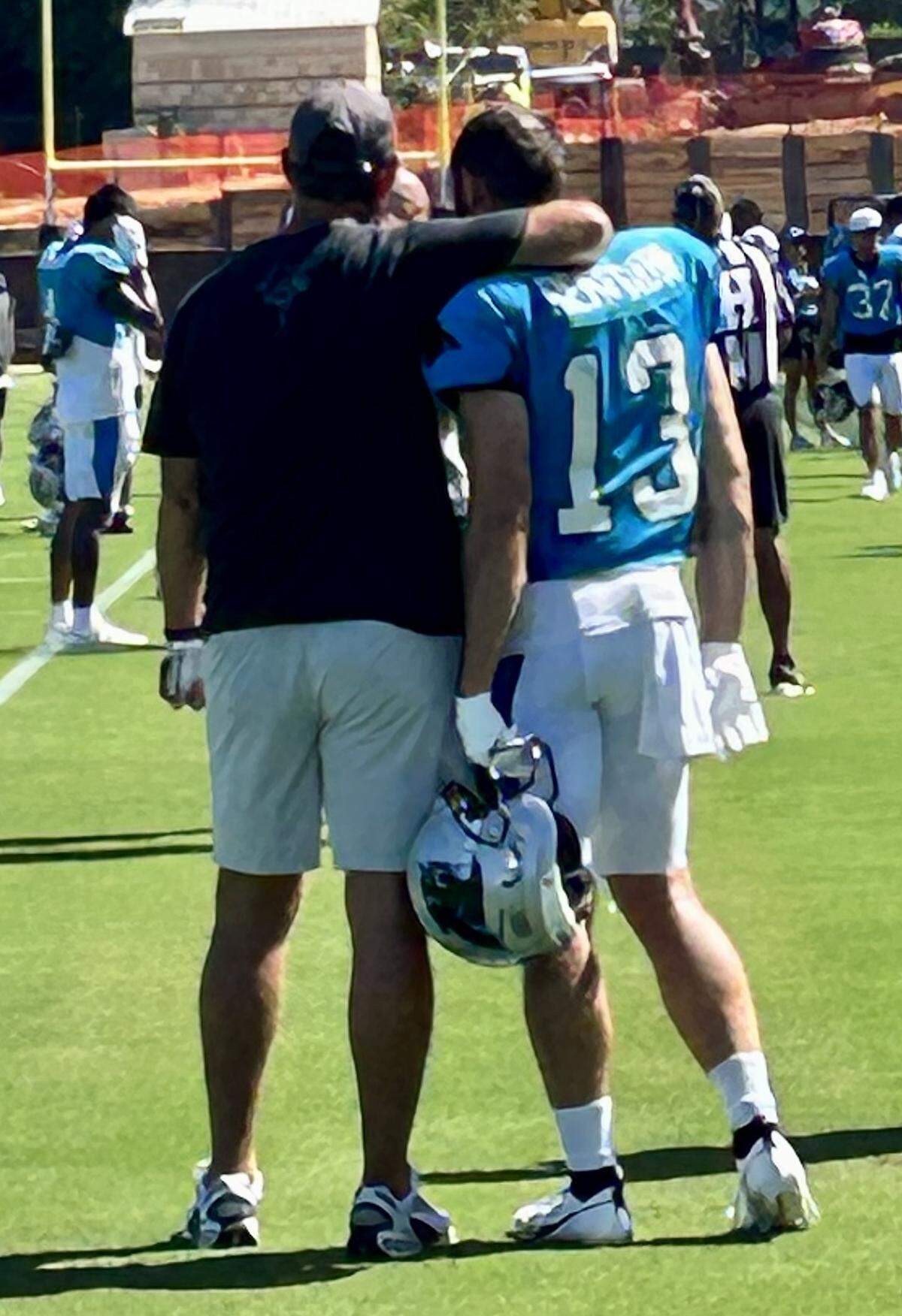 Clemson football coach Dabo Swinney (left) hugs Panthers wide receiver Hunter Renfrow on Monday, July 28, 2025. Renfrow used to play for Swinney at Clemson.