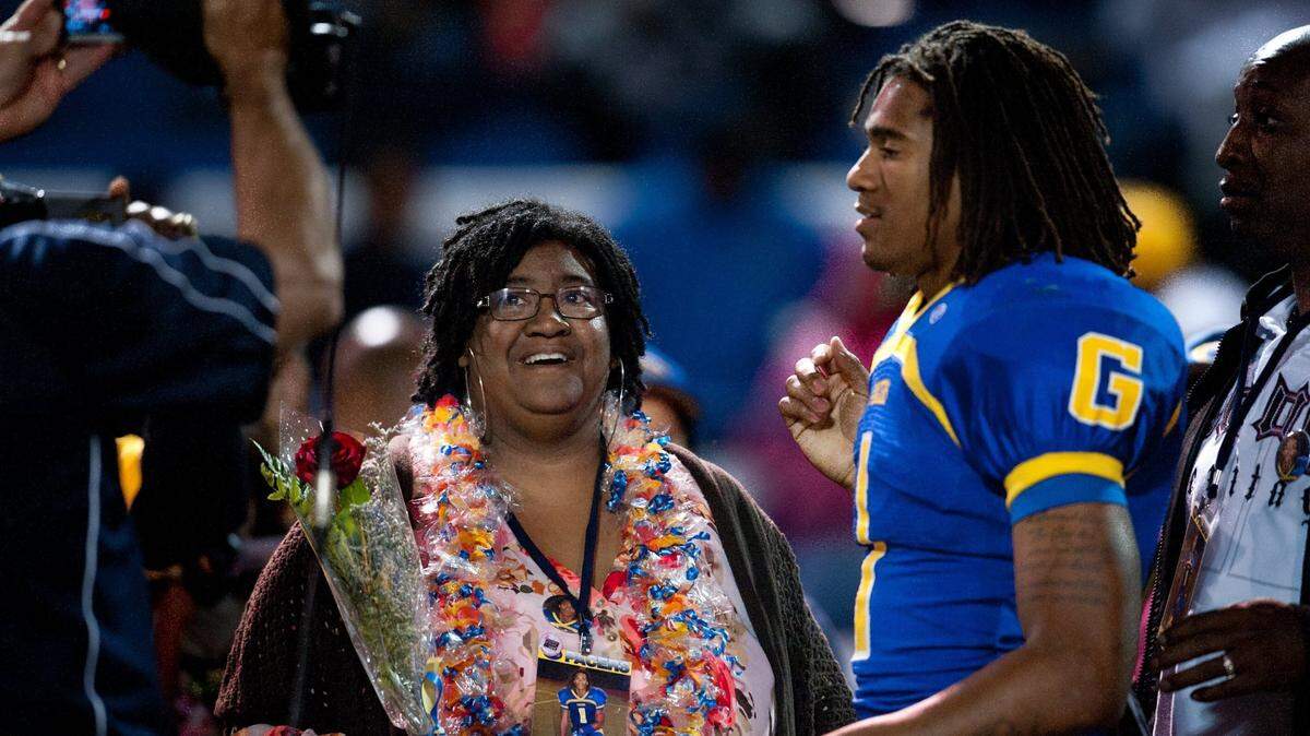 Shaq Thompson joins his mother, Patty, during Senior Night festivities Friday. Patty Thompson marvels at her son’s calm demeanor before and during games.