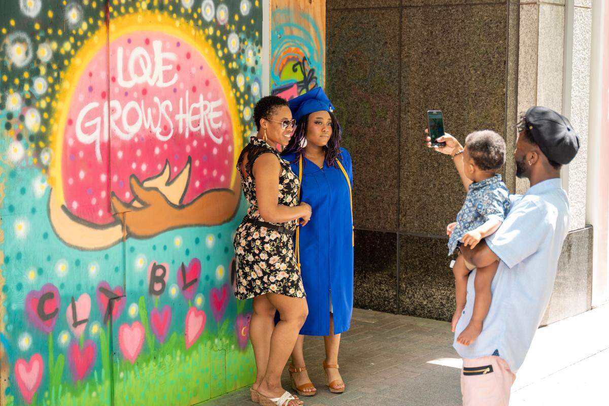 The vibrant colors of the murals uptown provided a photo backdrop for local high school graduates and their families on June 12, 2020.