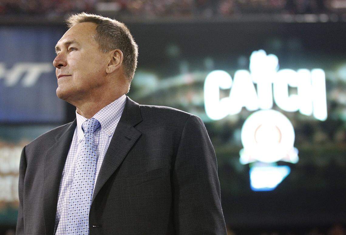 In this Dec. 23, 2013, file photo, former San Francisco 49ers wide receiver Dwight Clark is honored at halftime of an NFL football game between the 49ers and the Atlanta Falcons in San Francisco. Clark stands near the spot where he made a catch so famous it is referred to as "The Catch."