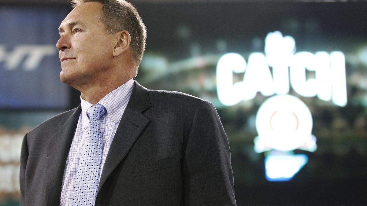 In this Dec. 23, 2013, file photo, former San Francisco 49ers wide receiver Dwight Clark is honored at halftime of an NFL football game between the 49ers and the Atlanta Falcons in San Francisco. Clark stands near the spot where he made a catch so famous it is referred to as "The Catch."
