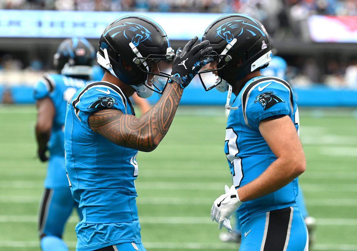 Carolina Panthers wide receivers Tetairoa McMillan, left and Hunter Renfrow, right, celebrate McMillan’s touchdown pass reception during action against the Dallas Cowboys on Oct. 12, 2025, at Bank of America Stadium. The Panthers defeated the Cowboys 30-27.