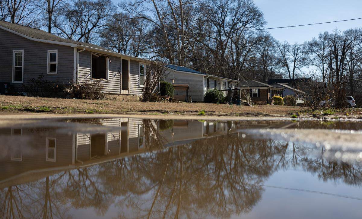 Flood damaged homes on Lake Drive in Charlotte, N.C., on Friday, February 14, 2025.