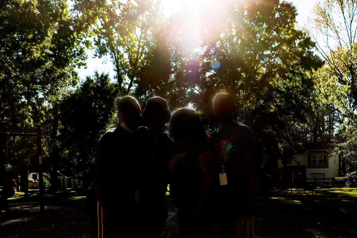 Four survivors of domestic violence stand together Wednesday, October 5, 2022, in Charlotte, NC.