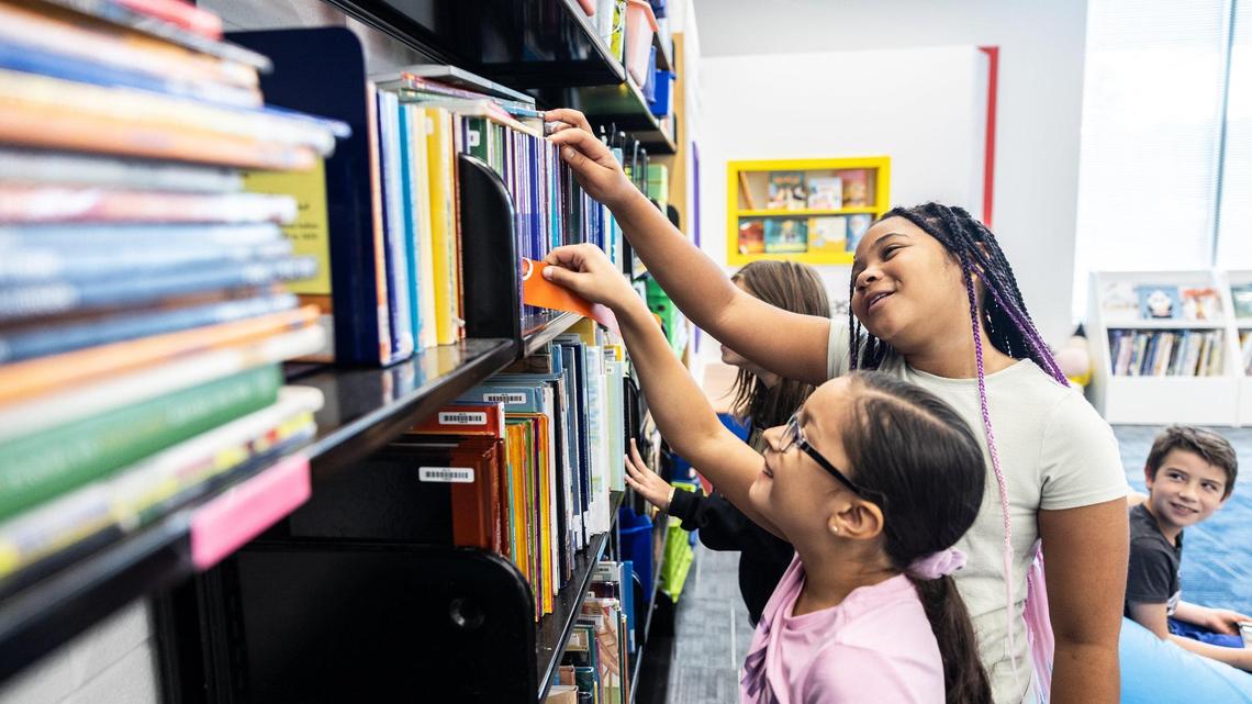 Fourth grade students check out books at Lake Norman Charter Elementary School in Huntersville, N.C., on Thursday, September 8, 2022.