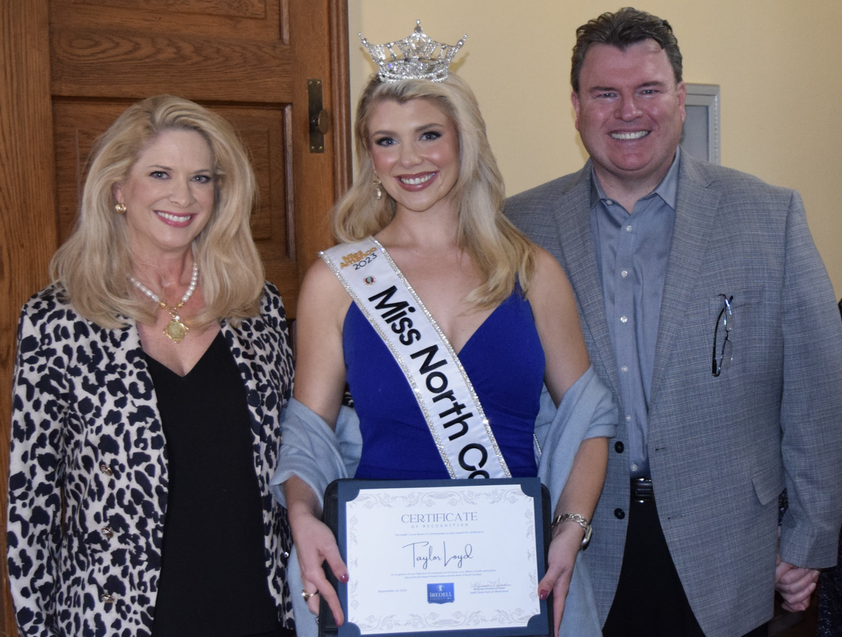 Taylor Loyd, photographed with her father Ashton and her mother Cinamon in September, when she was honored at an Iredell County Board of Commissioners meeting for her commitment to community service. Her parents, by the way, met the night Cinamon won Miss Statesville in 1992, when Ashton was working backstage as a pageant volunteer.