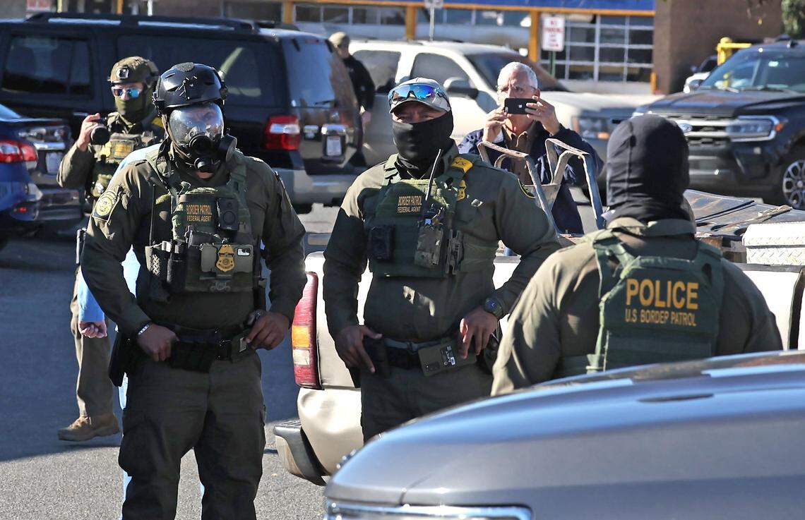 U.S. Customs and Border Patrol agents wait in the parking lot of the Compare Foods on North Tryon St. in Charlotte, NC on Monday, November 17, 2025.