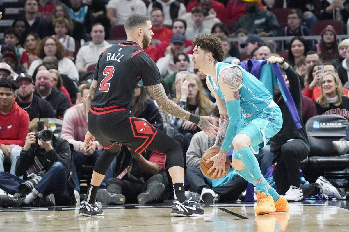 Chicago Bulls guard Lonzo Ball (2) defends Charlotte Hornets guard LaMelo Ball (1) during the first quarter at United Center.