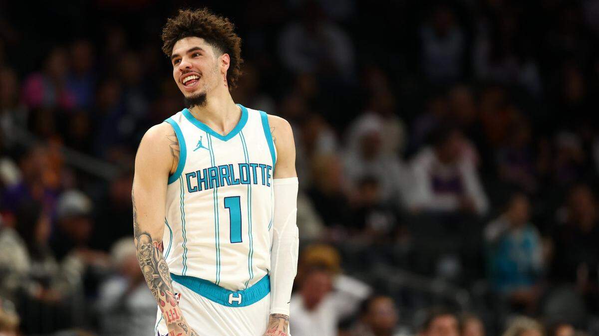 Charlotte Hornets guard LaMelo Ball (1) reacts after making a basket against the Phoenix Suns during the first half at Footprint Center.