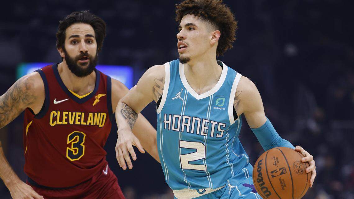LaMelo Ball, right, of the Charlotte Hornets dribbles while defended by Ricky Rubio of the Cleveland Cavaliers in the first half at Rocket Mortgage Fieldhouse on October 22, 2021 in Cleveland, Ohio. (Photo by Rick Osentoski/Getty Images)