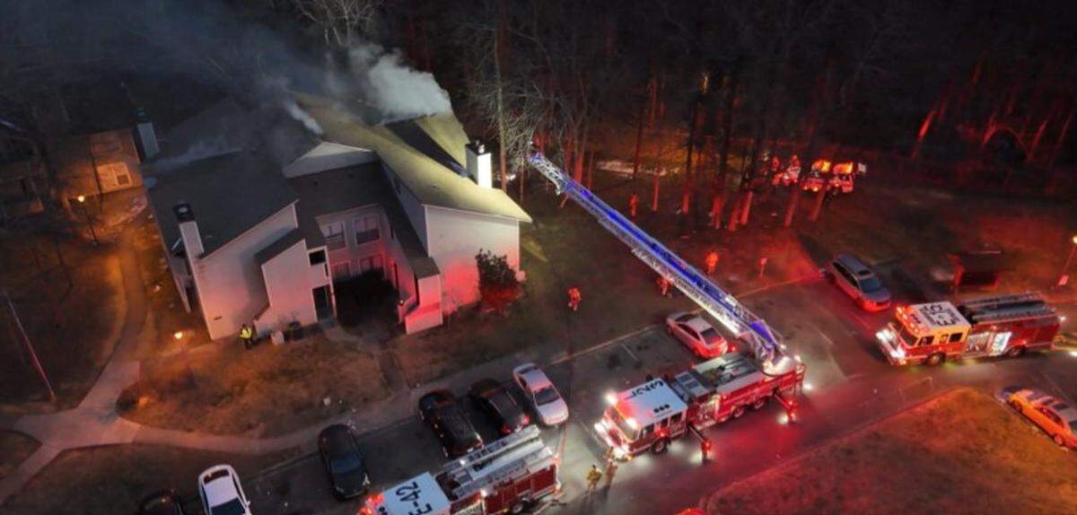 Firefighters battled a fire in a Charlotte apartment building on Wednesday. A person who was found dead in the fire died before flames broke out, fire officials said.