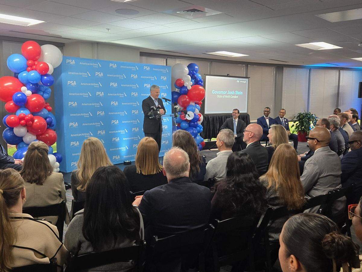Gov. Josh Stein speaking at the official opening of the PSA headquarters in Charlotte.