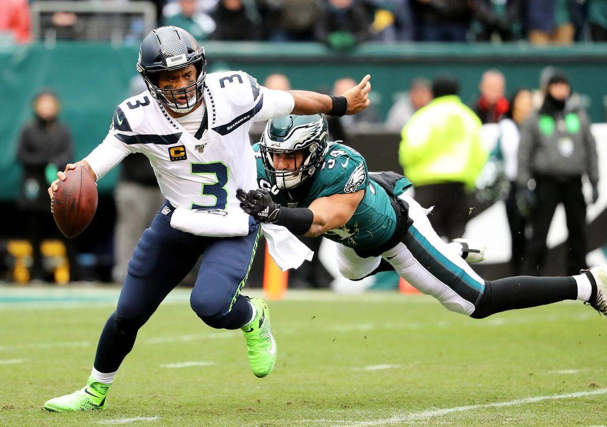 Seattle Seahawks QB Russell Wilson (3) breaks free from Philadelphia Eagles LB Kamu Grugier-Hill