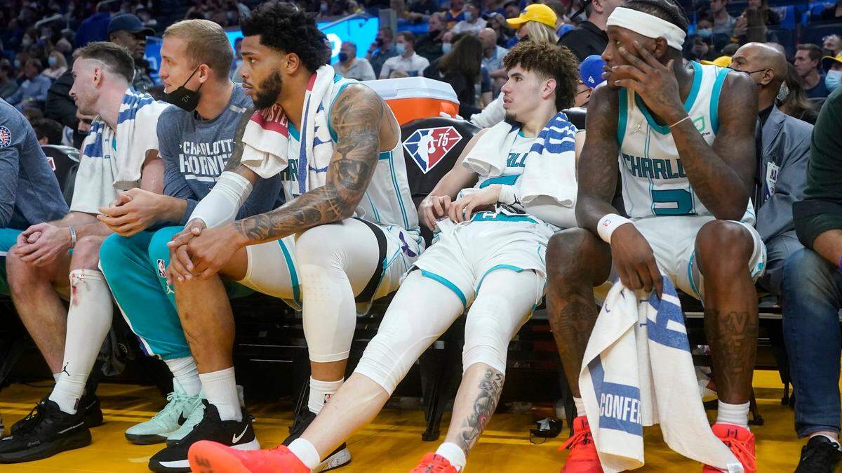 Charlotte Hornets’ Gordon Hayward, from left, sits on the bench with Mason Plumlee, Miles Bridges, LaMelo Ball and Terry Rozier during the second half of their 114-92 loss at the Golden State Warriors in San Francisco on Wednesday.