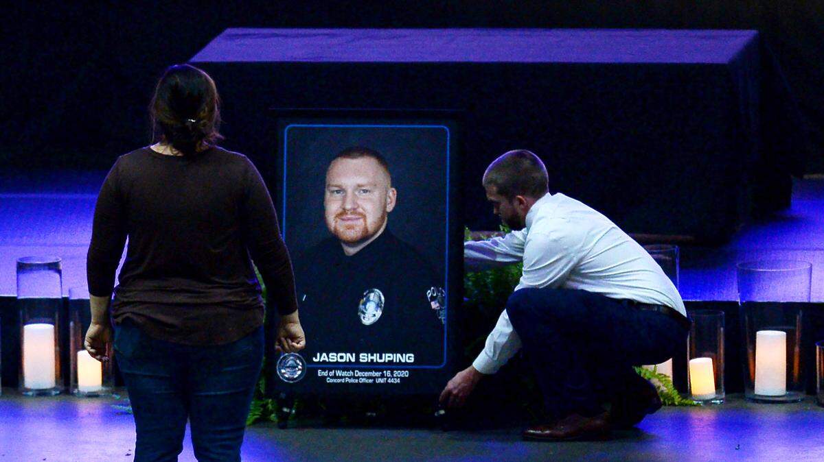 A portrait of fallen Concord police Officer Jason Shuping is positioned at the Cabarrus Arena and Events Center on Tuesday, December 22, 2020. Shuping was killed in the line of duty last week while responding to an attempted carjacking outside a fast food restaurant in Concord, NC.