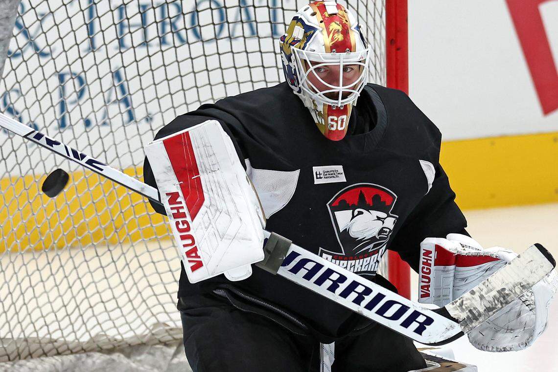 Charlotte Checkers goalie Chris Driedger flicks a puck away from the goal during practice at Bojangles Coliseum in Charlotte, NC on Tuesday, October 15, 2024. The Checkers will play their first two home games against the Cleveland Monsters on Friday, October 18th and Saturday, October 19th.
