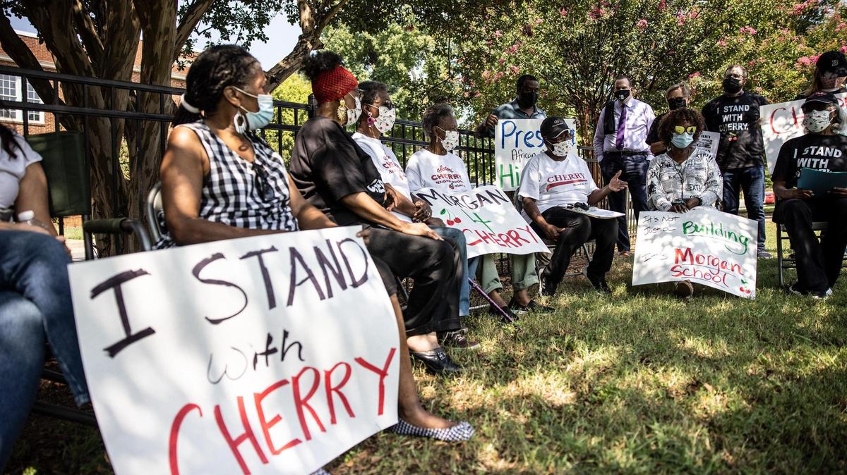 Cherry community members gather outside the historic Morgan School on Sept. 10, 2021. Neighbors want the vacant CMS building to be restored as a community center. The school sits in the heart of Cherry, Charlotte’s oldest surviving African American neighborhood.