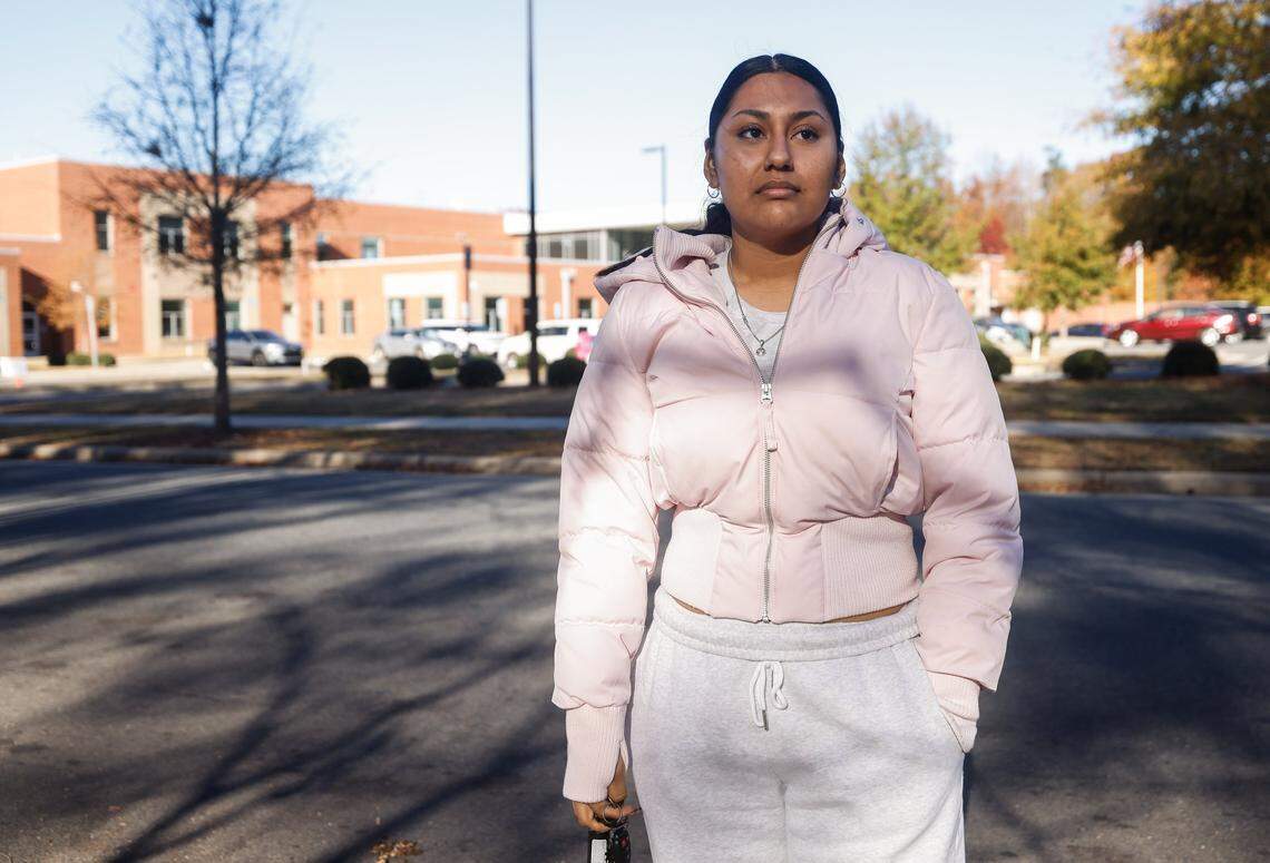 Arelee Cuautle stands outside Charlotte East Language Academy where she dropped off her brother and cousin this morninig on Monday, November 17, 2025. “I was born here,” says Cuautle, “and I’m so scared because they’re targeting my neighborhood, so clearly I fit into some demographic. They’re targeting people who look like me, who speak my language; so it does make me scared.”