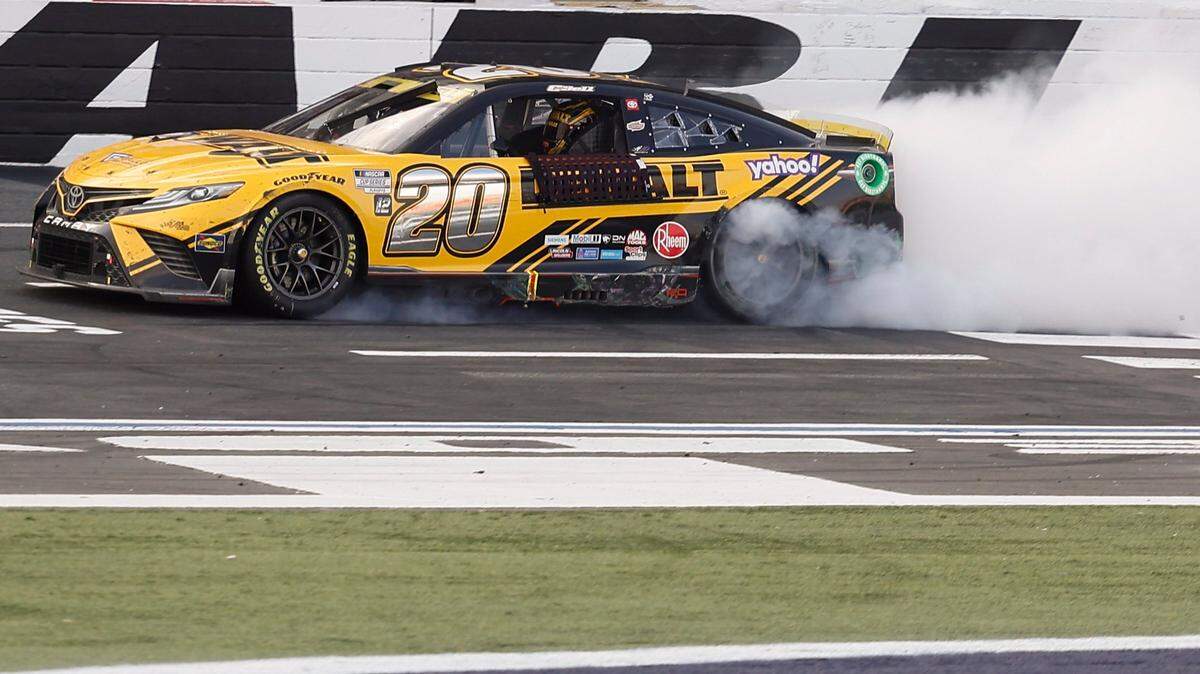 NASCAR Cup Series driver Christopher Bell (20) burns out after winning the Bank of America Roval 400 at Charlotte Motor Speedway in Charlotte, N.C., Sunday, Oct. 9, 2022.