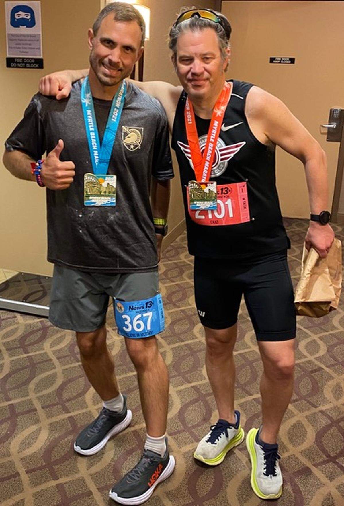 Frank Turner with running friend Chad Champion, after the Myrtle Beach Marathon in 2021.