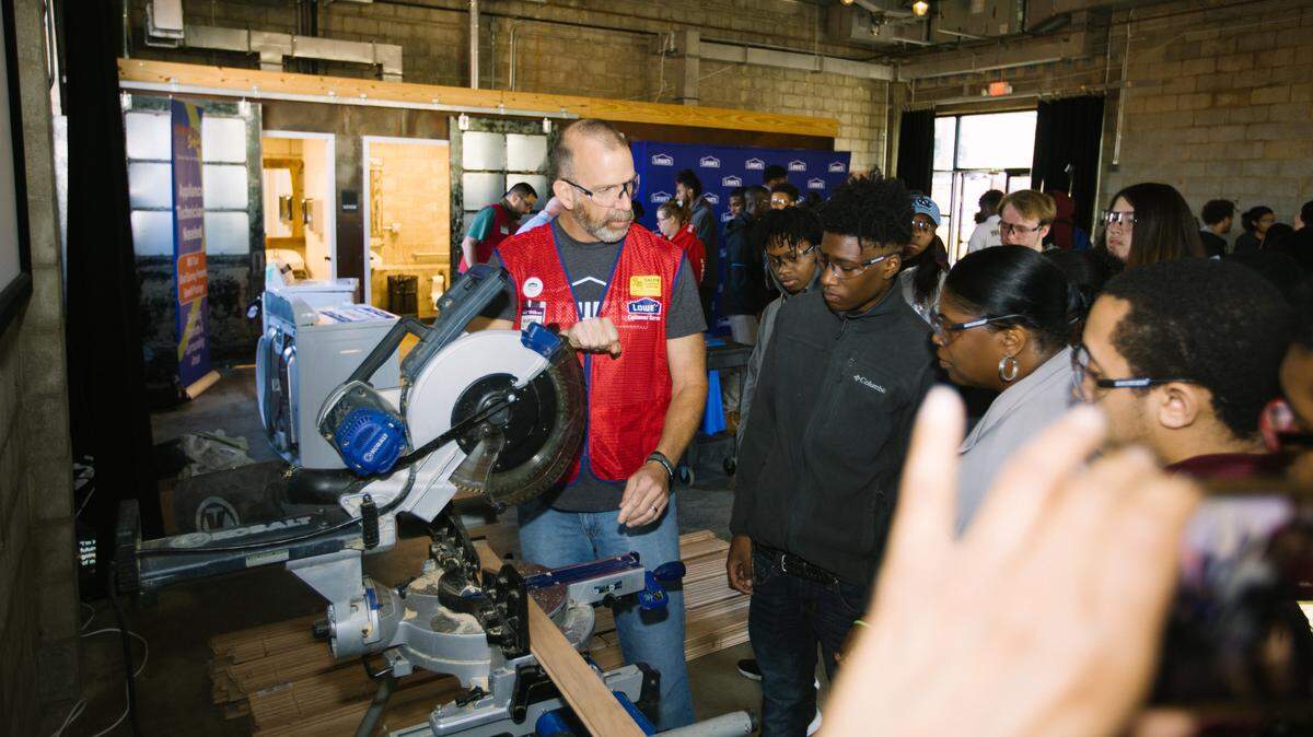 Lowe’s employees met with Charlotte Mecklenburg Schools students during an immersion event hosted at Camp North End last fall.