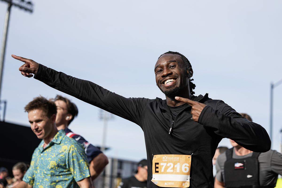 A participant poses for a photo after competing in the Novant Health Charlotte Marathon Saturday, Nov. 15, 2025, in Charlotte, N.C.