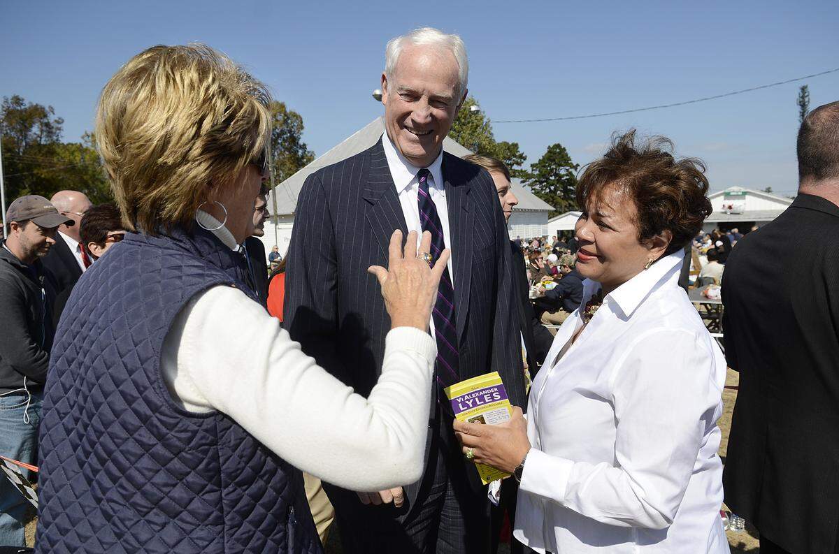 Belinda Crowell, who worked for seven Charlotte mayors talks with former mayor Richard Vinroot  and Vi Alexander Lyles who is running for an at-large city council seat. On Thursday Oct. 24, 2013  politics and pork were stirred together like Brunswick stew at the 84th annual Mallard Creek Barbecue. The event brought thousands of people to the yearly right of passage where citizens not only can get their hands on a great slaw and pulled pork sandwich but also their local politicians who come out in force to campaign for election.