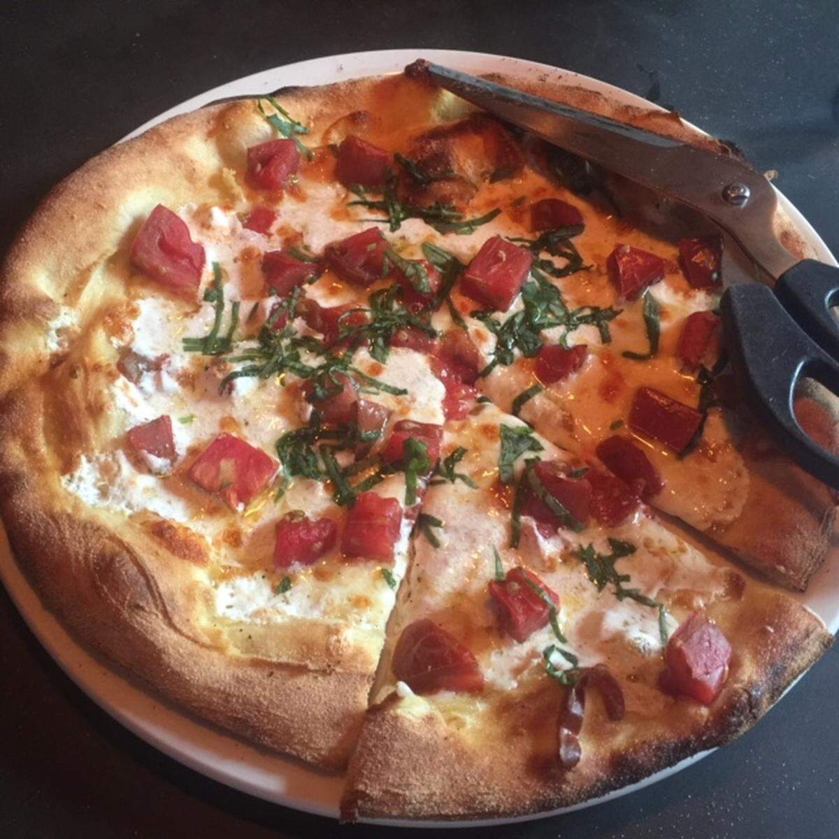Stagioni's version of margherita has more cheese than most, and chunks of tomato on top.