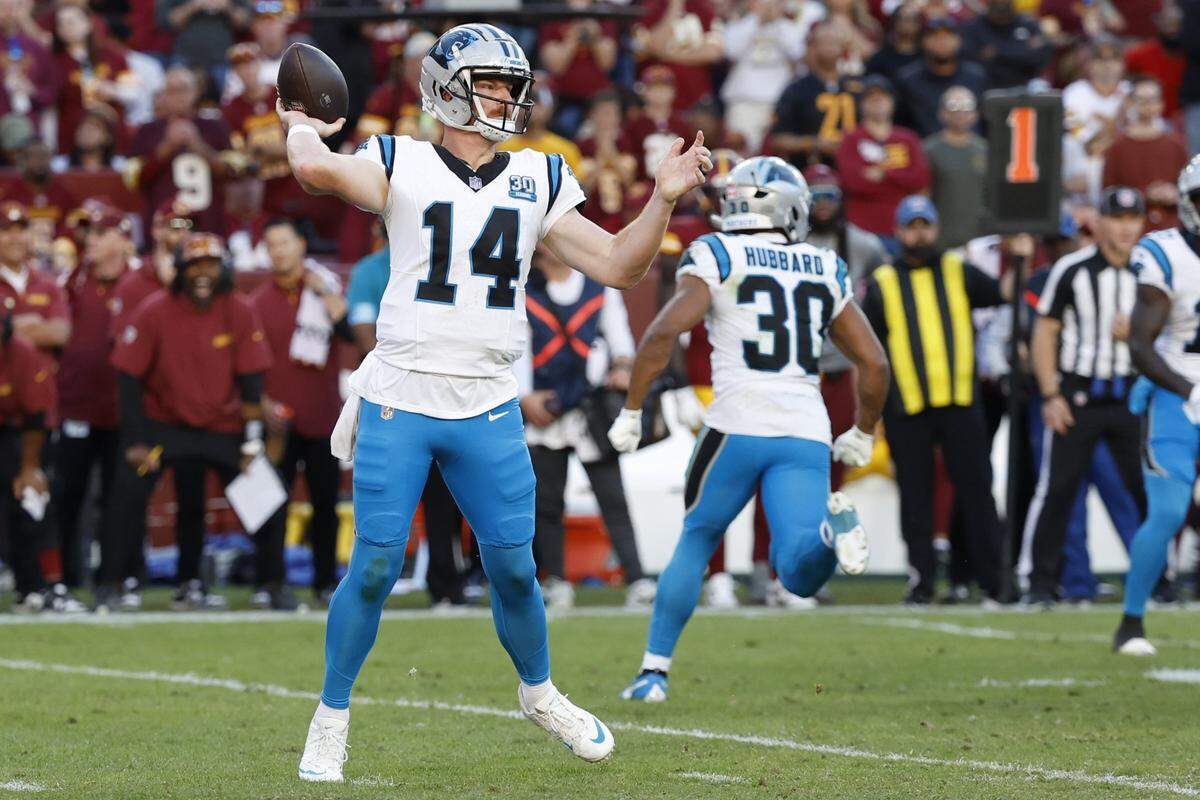 Oct 20, 2024; Landover, Maryland, USA; Carolina Panthers quarterback Andy Dalton (14) passes the ball against the Washington Commanders during the second quarter at Northwest Stadium. Mandatory Credit: Geoff Burke-Imagn Images