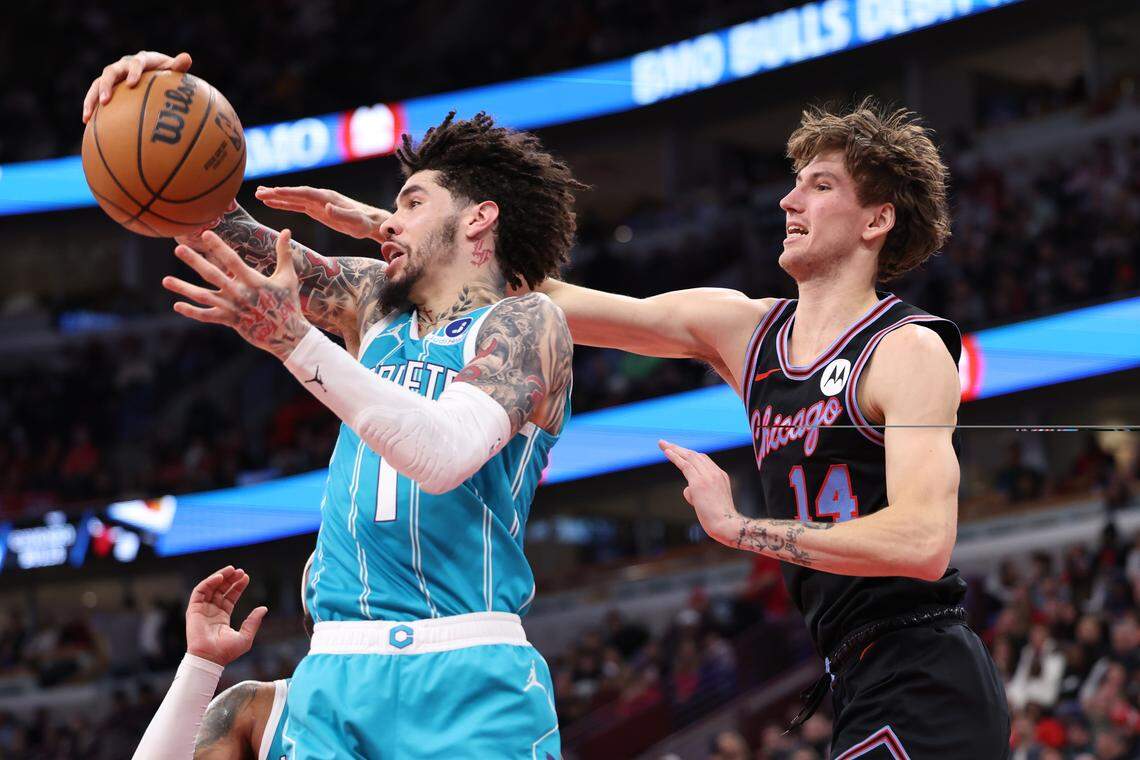 Charlotte’s LaMelo Ball battles for a rebound with Chicago’s Matas Buzelis during Saturday’s first half at the United Center.