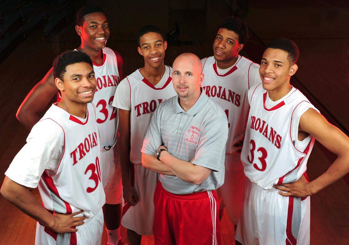 Olympic High has the best basketball team its ever had this year with five Division 1 recruits (L-R) Al Freeman (30), Josh Smith (32), Deriece Parks (2), head coach Ty Baumgarner, B.J. Gladden (24) and John Brown (33). Jeff Siner - jsiner@charlotteobserver.com
