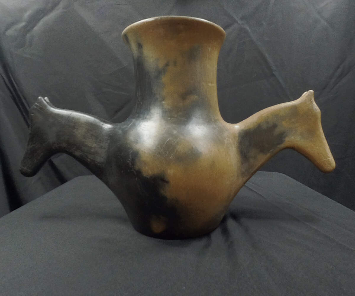 This pottery piece called “Horse Jar” was by made artist Earl Robbins of the Catawba Indian Nation. Catawba pottery is made without a wheel or kiln. It’s usually hand-molded.